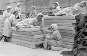 Female workers lie on mattresses