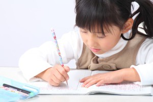 Schoolgirl writing in Japan