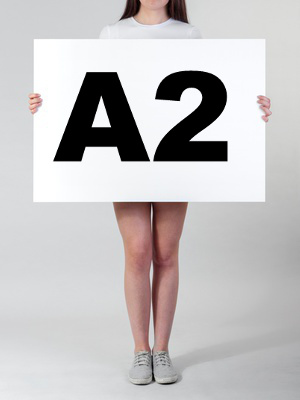 Woman holding a blank A2 poster