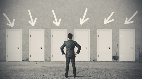 Businessman and many doors