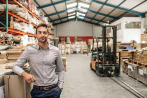 Smiling Manager in a Warehouse