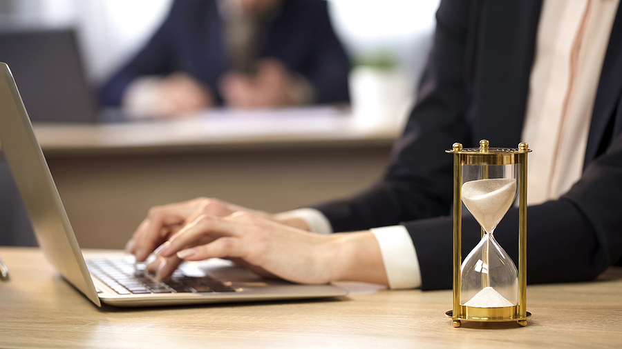 Working with Laptop and Hourglass